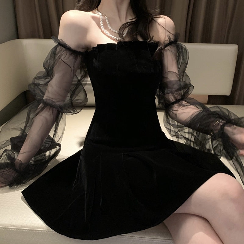 Robe en maille à manches bulles et épaules dénudées à la taille